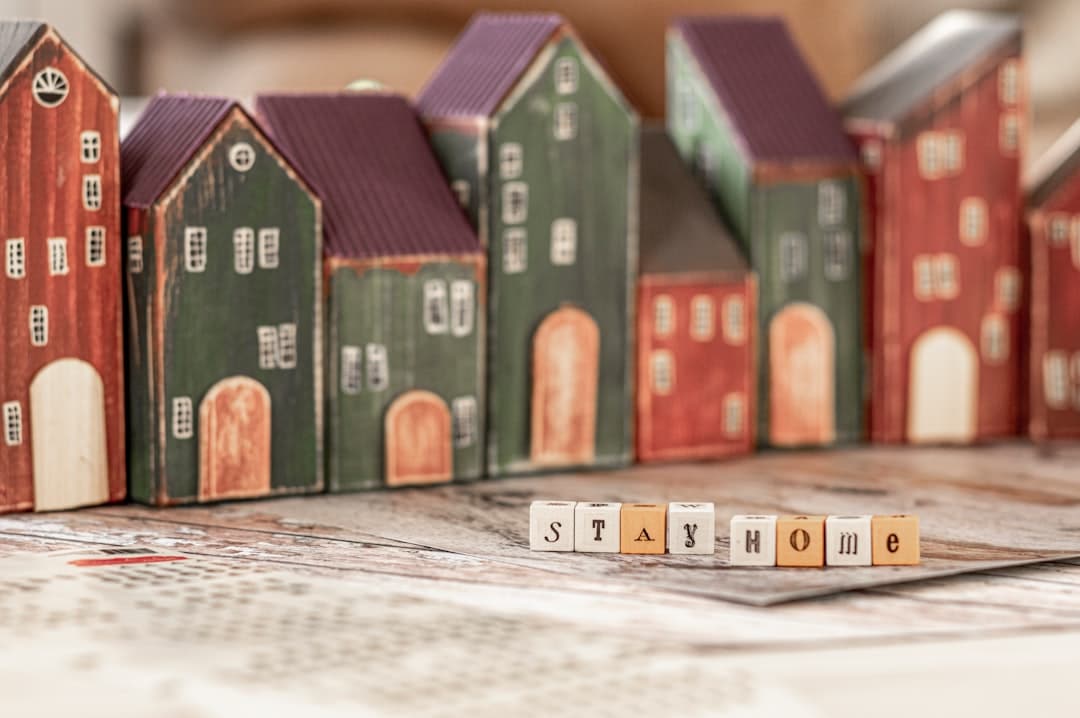 A house model with currency or a piggy bank, symbolizing savings.