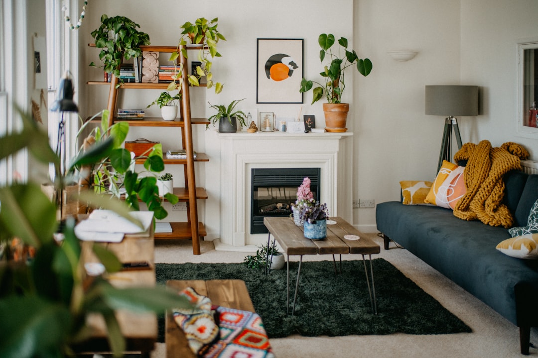 Castle Rock homeowner sits at a clean wooden table in a bright, modern living room, strategically reviewing documents for ...